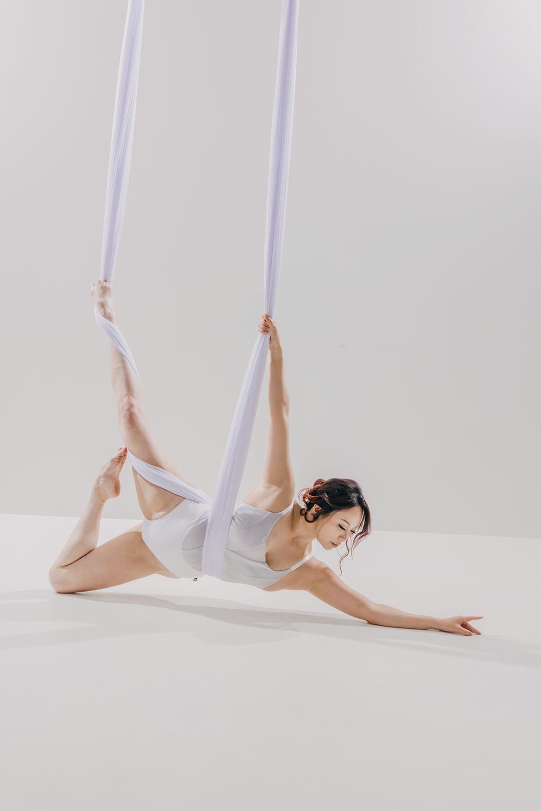 Dancer in white silk with an elegant updo