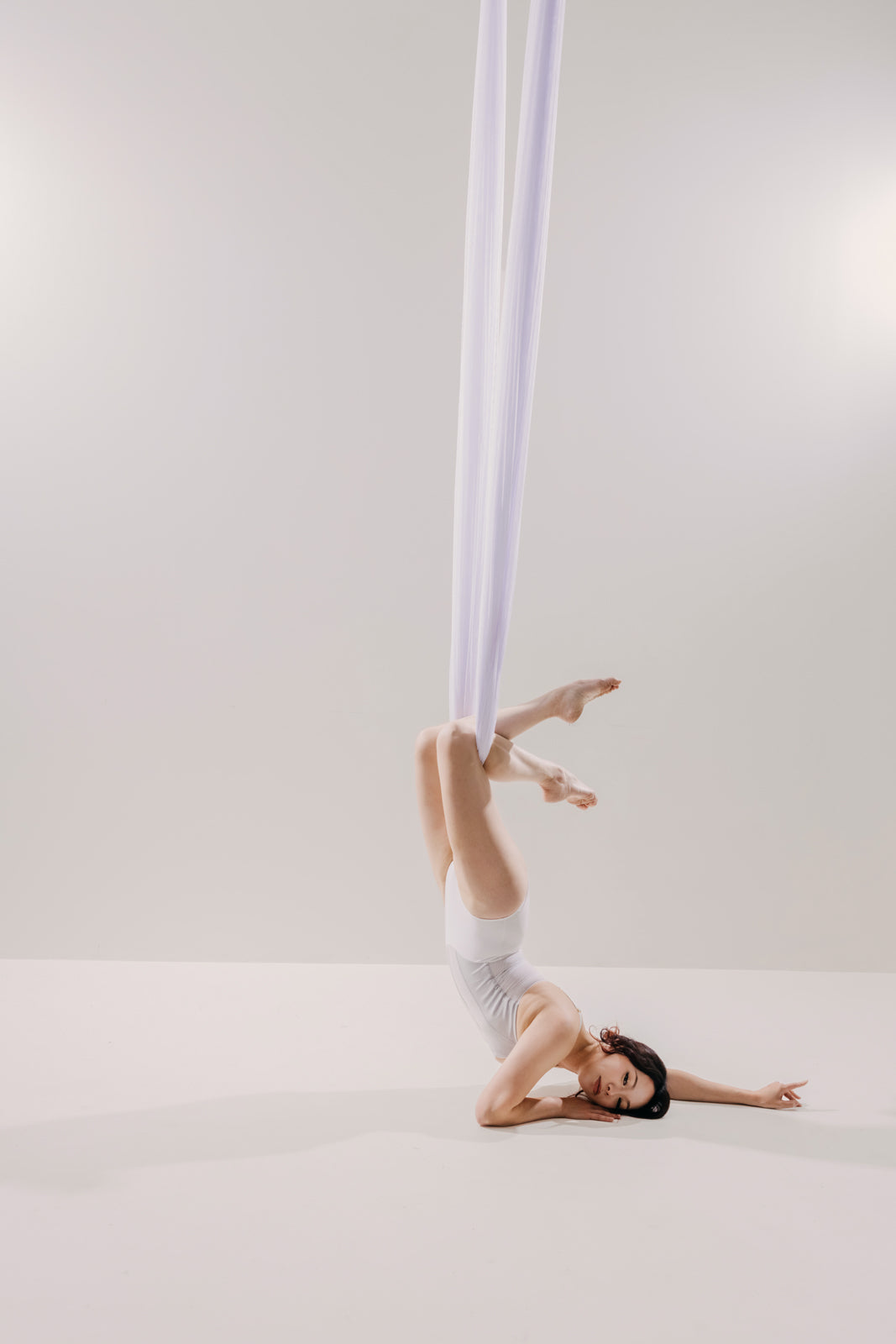 Dancer in sheer white mesh on the light set