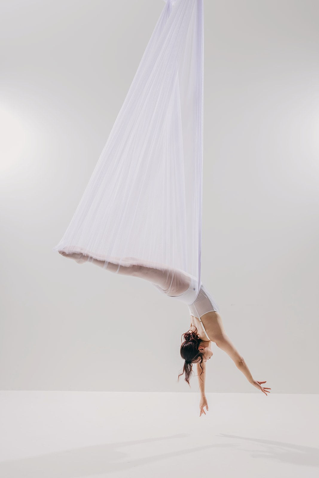 Dancer in sheer white mesh on the light set