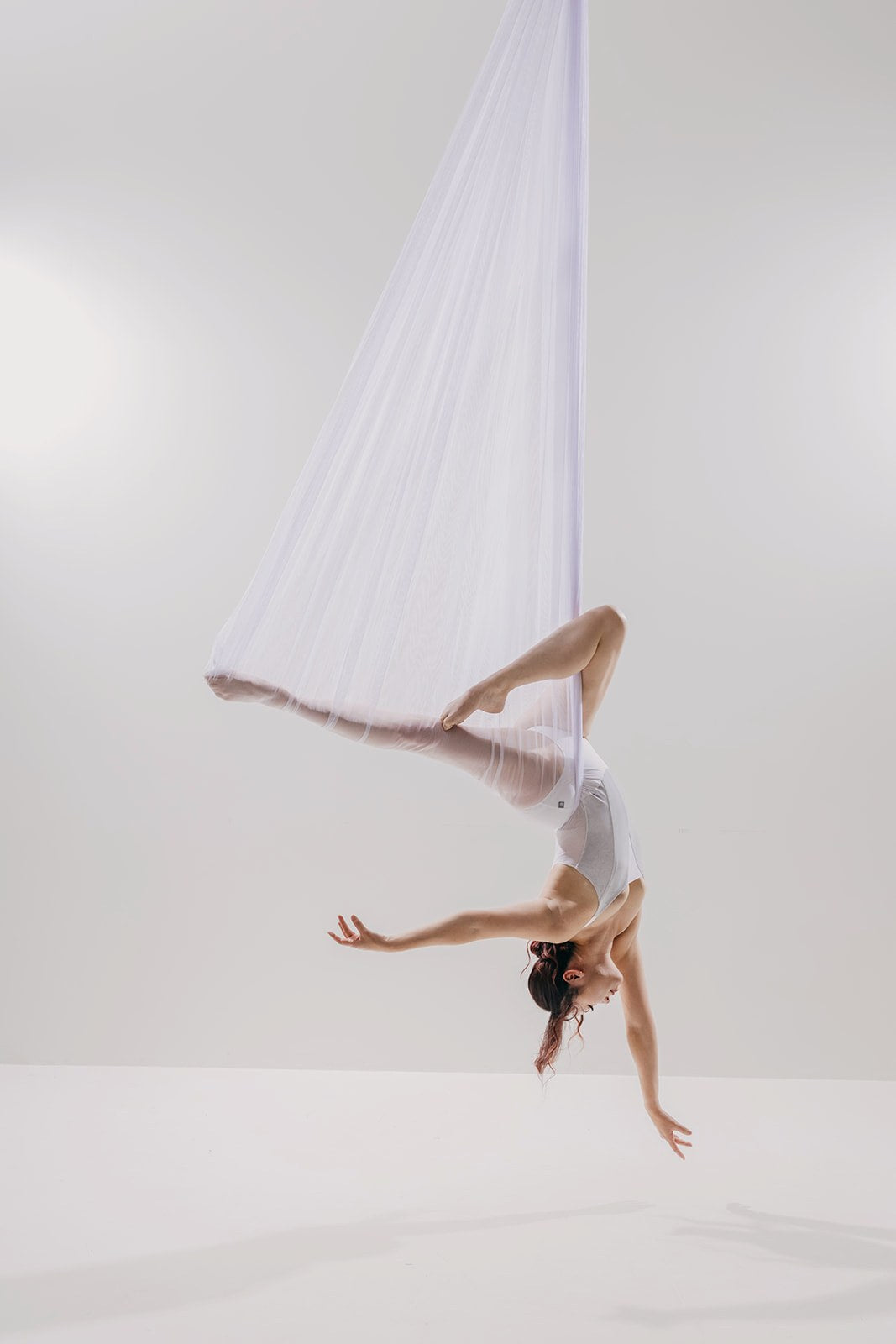 Dancer in sheer white mesh on the light set