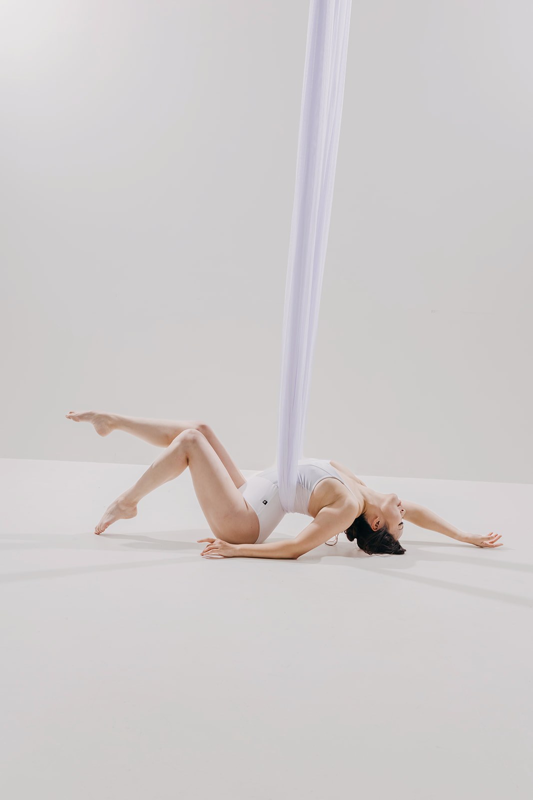 Dancer in sheer white mesh on the light set