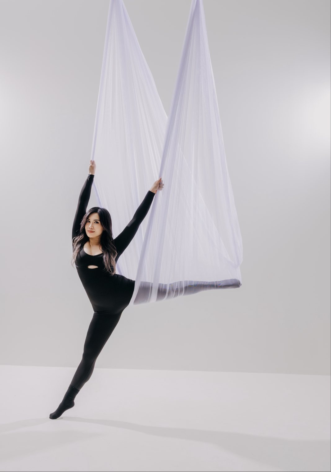 Dancer in sheer white mesh on the light set